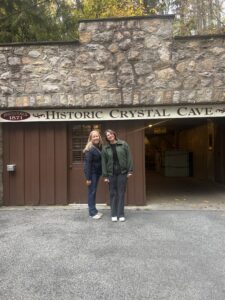 Foundation team members standing at the opening of Crystal Cave, which was created for guests to safely enter the cave.